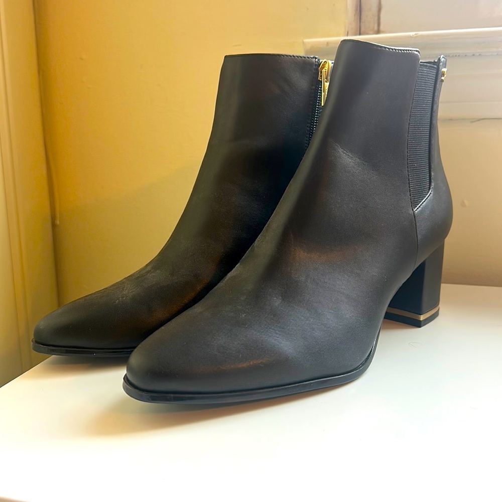Black leather Calvin Klein boots with gold trim